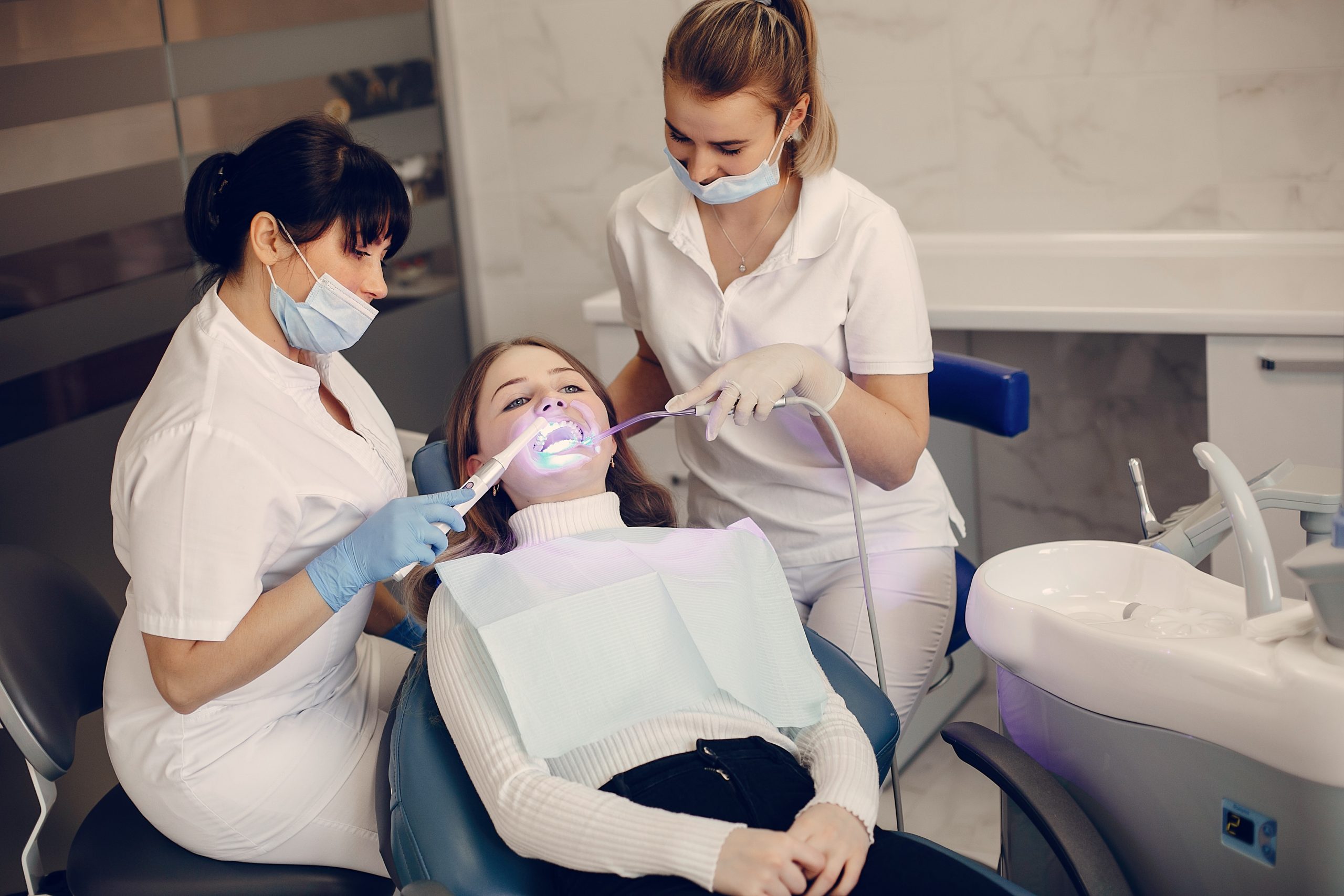 Beautiful girl sitting in the dentist’s office